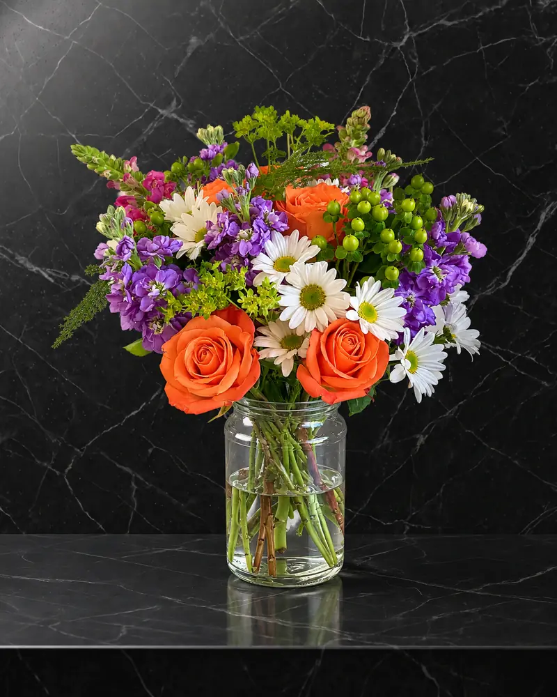 Example with sample flowers: a vase arrangement in the Polished black marble room, kept as made